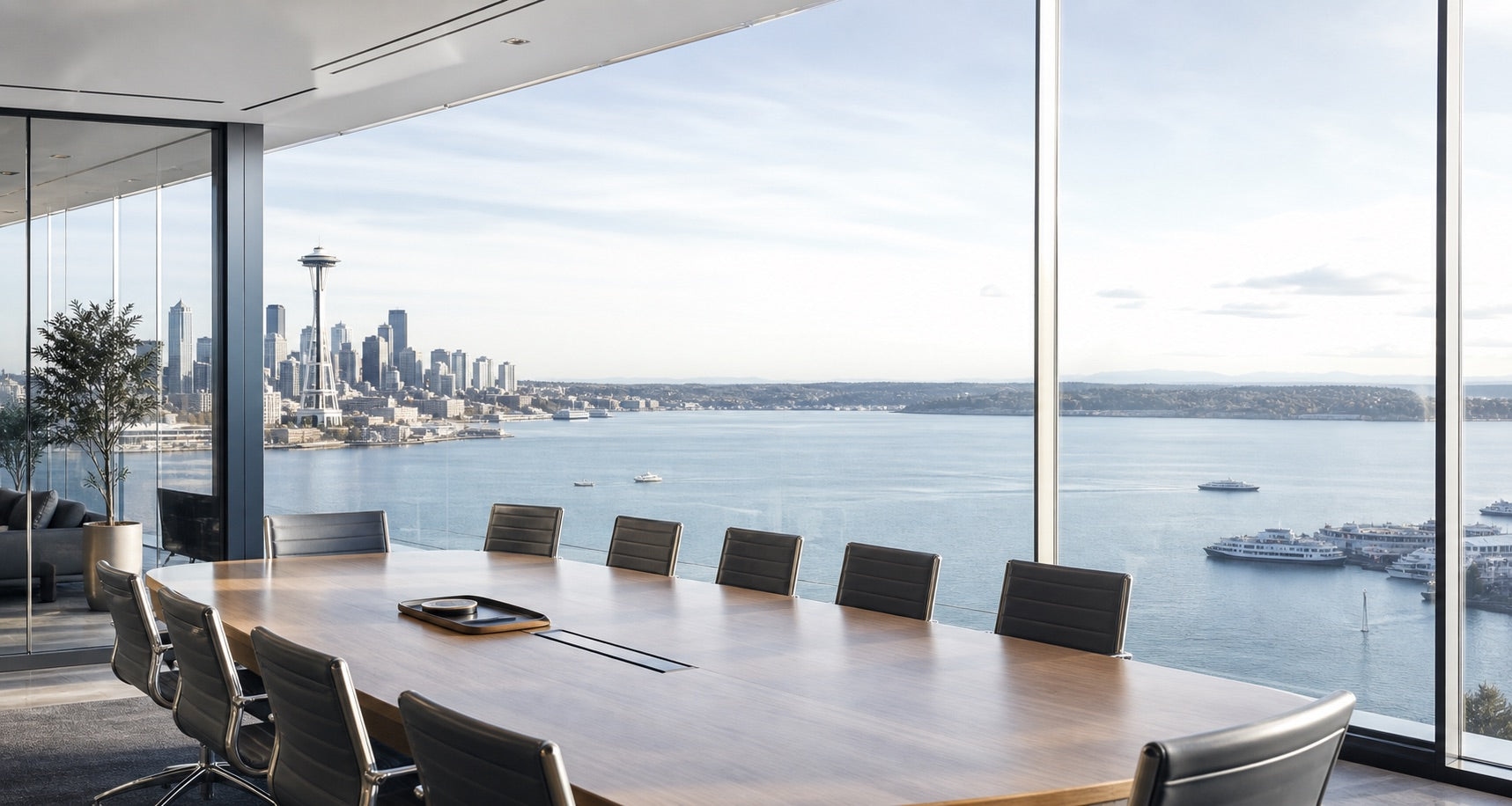 Sunlit Seattle waterfront boardroom with skyline and water views